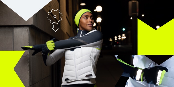 Two runners stretching in the dark