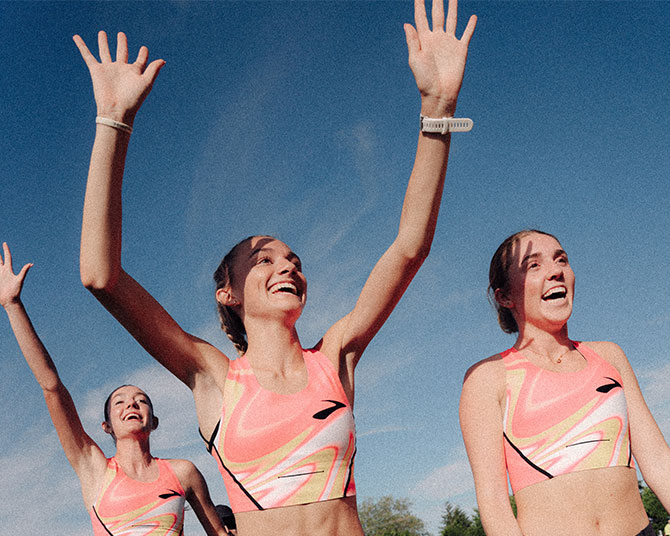 Runners waving